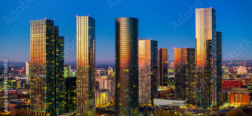 Panoramic image Manchester city skyline touched by the golden color of the twilight  photo