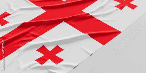 Flag of Georgia. Fabric textured Georgia flag isolated on white background photo