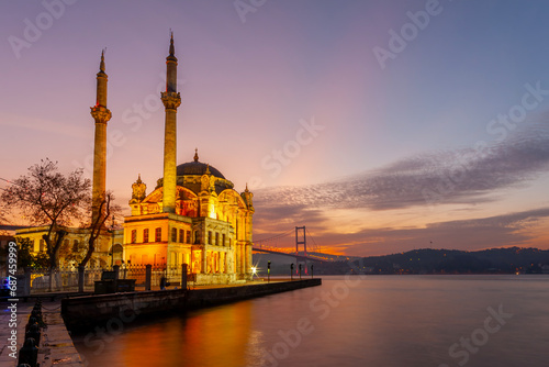 Ortakoy Mosque and Bosphorus bridge in Istanbul at sunrise, Turkey photo