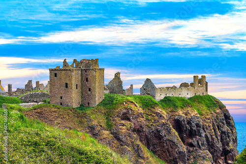 Dunnottar Castle is a ruined medieval fortress located upon a rocky headland on the north-eastern coast of Scotland.