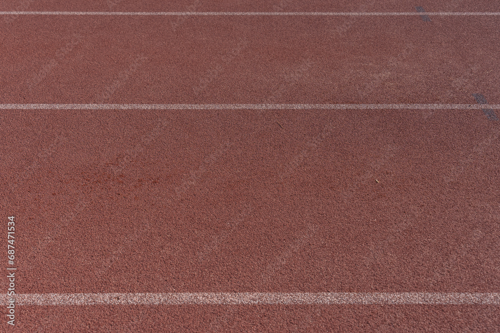 Background image of an athletics track with its lines of lanes delimiting it. Background image of an athletics track with its lines of lanes delimiting it.