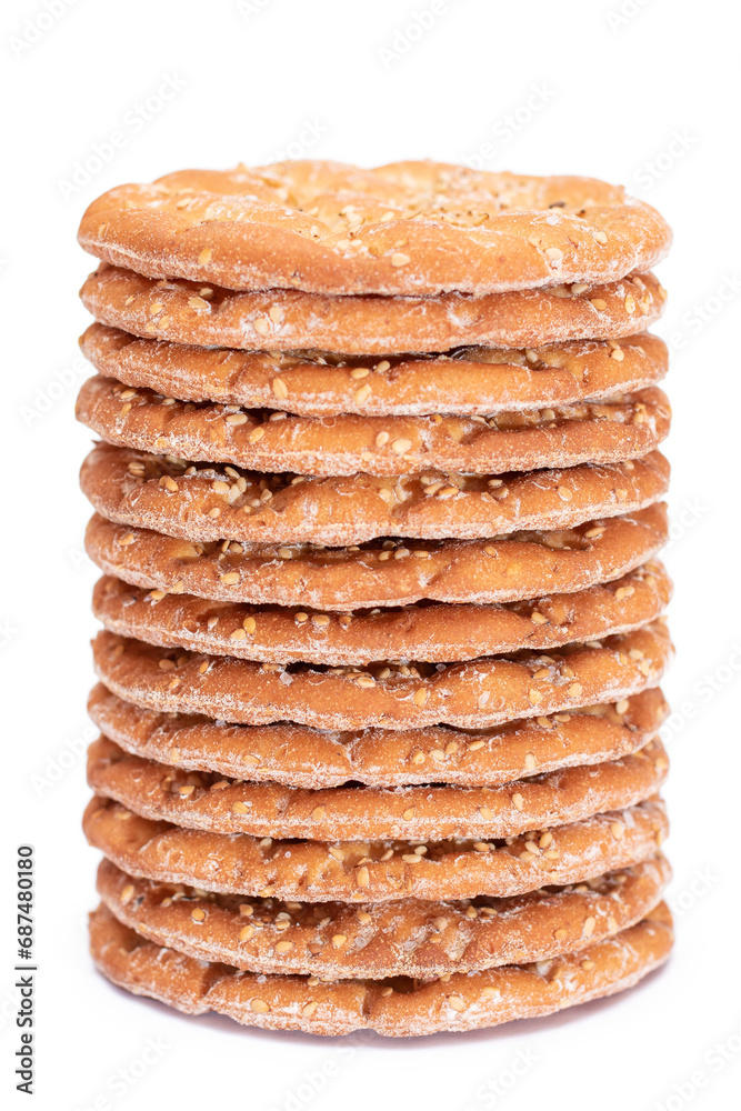 A Stack of Round Salt Crackers with Sesame Isolated on White Background. Dry Snacks - Isolation A Stack of Round Salt Crackers with Sesame Isolated on White Background. Dry Snacks - Isolation