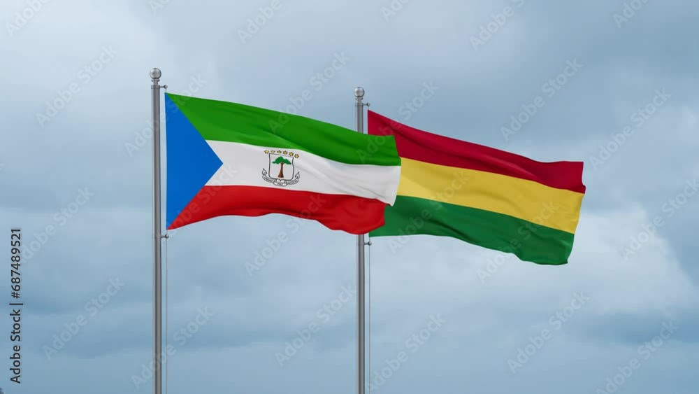Bolivia flag and Equatorial Guinea flag waving together on cloudy sky, endless seamless loop, two country relations concept Bolivia flag and Equatorial Guinea flag waving together on cloudy sky, endless seamless loop, two country relations concept