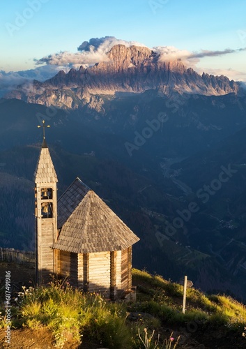 wooden church and mount Civetta Alps Dolomites mountains
