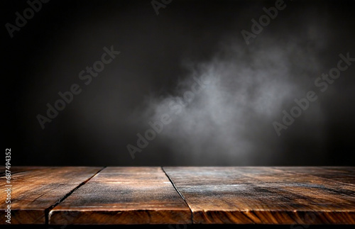 Old wooden table with smoke on dark background