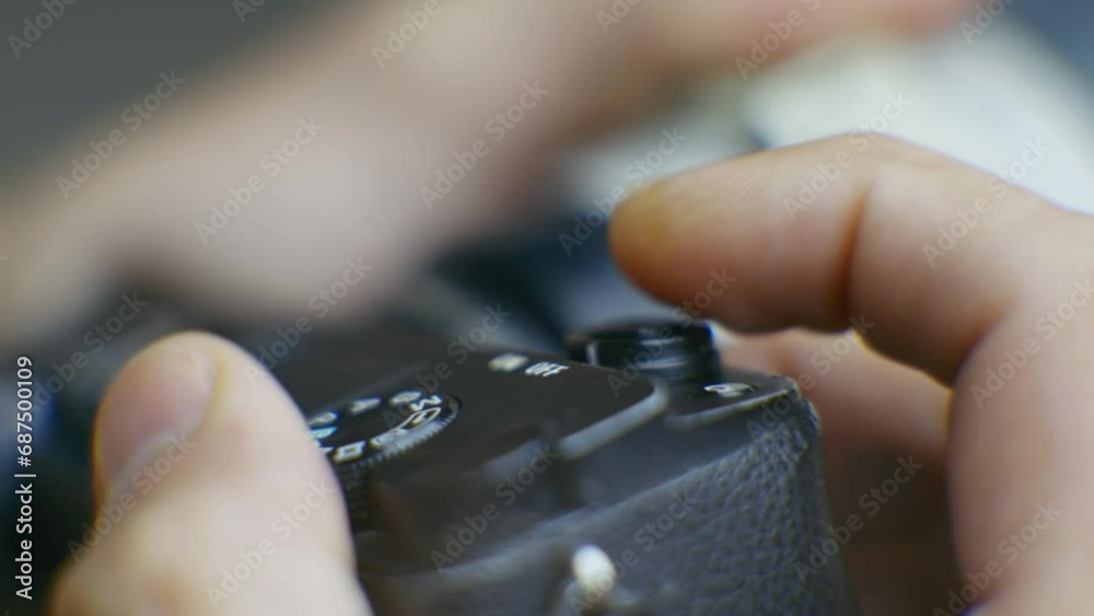 photographer takes picture by pressing button on digital camera 