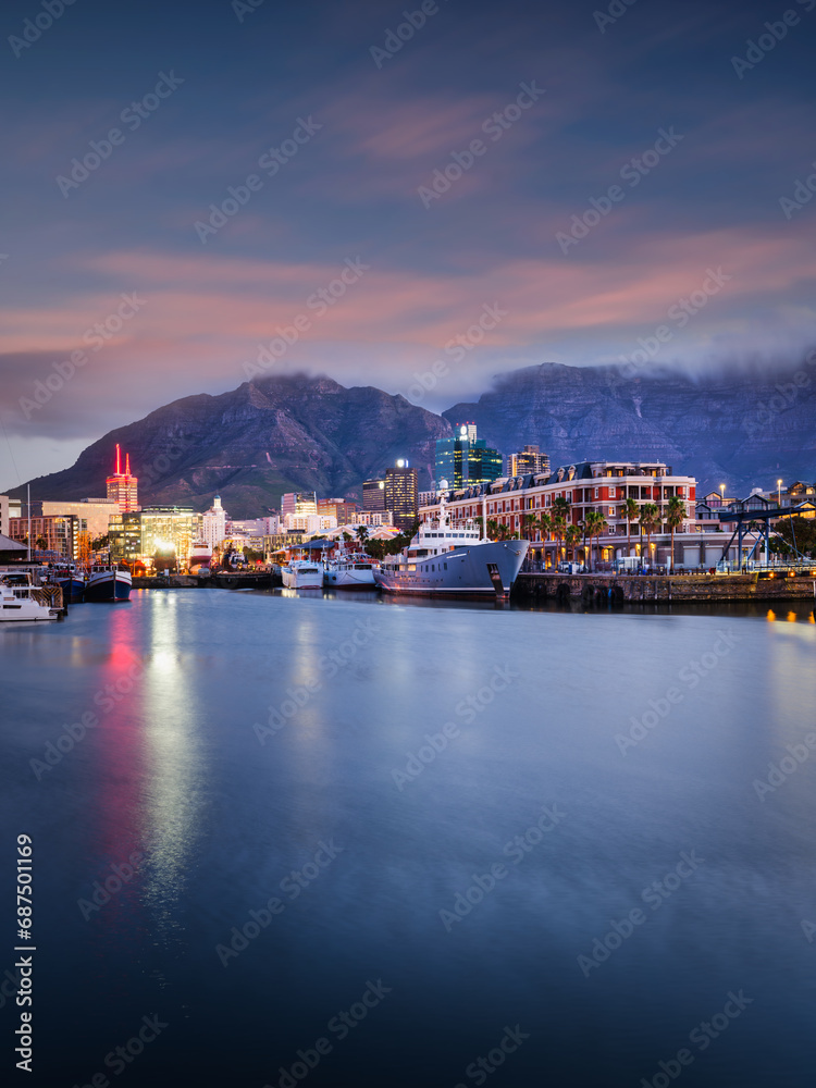 Vertical shot of the Waterfront and cape town city lights at dusk, Cape Town, South Africa
