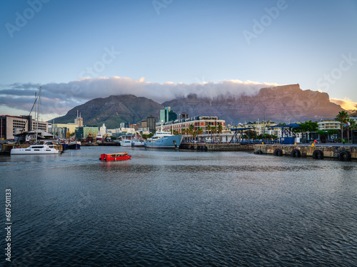 Cape Town city buildings, waterfron and table mountain during sunset, Cape Town, South Africa