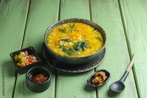 Manado porridge on the table. Manado porridge imade from rice, basil, waterspinach, pumpkin, corn. Bubur manado photo