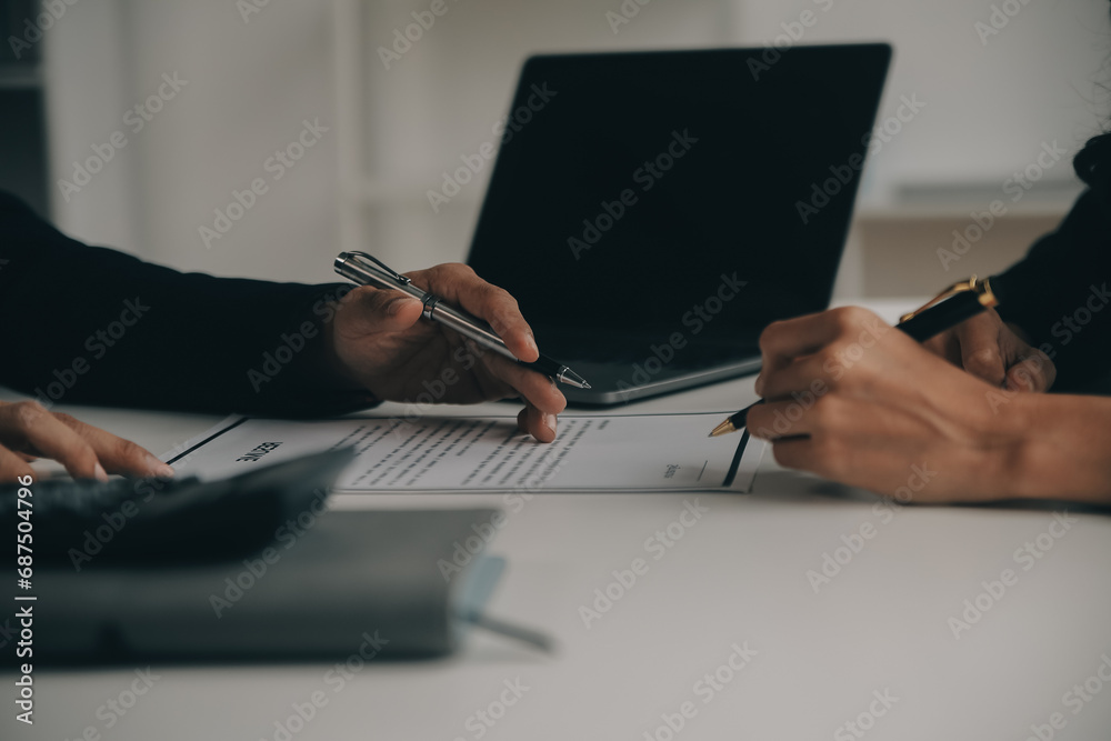 Businessman or job seeker review his resume on his desk before send to finding a new job with pen, necktie, glasses and digital tablet. - obrazy, fototapety, plakaty 