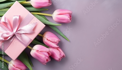 Holiday gift box and pink tulips, thanksgiving valentines day concept background © lin
