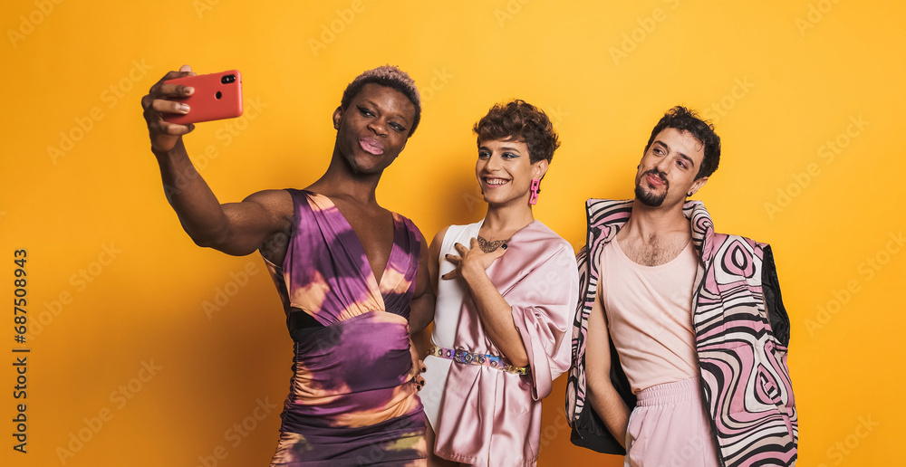 Multiethnic trans men taking a selfie in a photographic studio - obrazy, fototapety, plakaty 