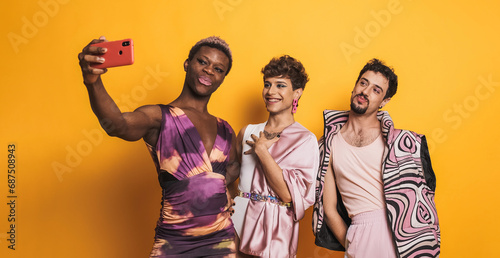 Multiethnic trans men taking a selfie in a photographic studio photo