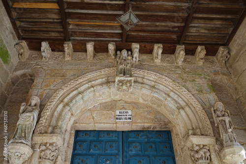 Romanesque doorway of the church of Santa María Salomé. Above the archivolt stands out a seated image of the Virgin
Santiago de Compostela, Galicia, Spain 10092023 photo