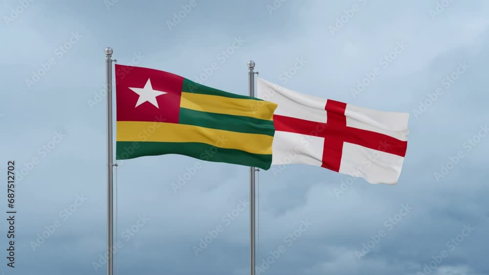 England flag and Togo flag waving together on cloudy sky, endless seamless loop, two country relations concept England flag and Togo flag waving together on cloudy sky, endless seamless loop, two country relations concept