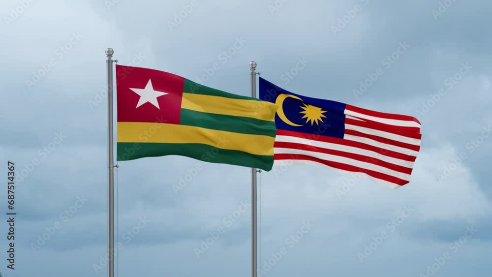 Malaysia and Togo flag waving together on cloudy sky, endless seamless loop, two country cooperation concept Malaysia and Togo flag waving together on cloudy sky, endless seamless loop, two country cooperation concept