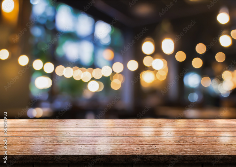 Empty wooden table top with lights bokeh on blur restaurant background. Empty wooden table top with lights bokeh on blur restaurant background.