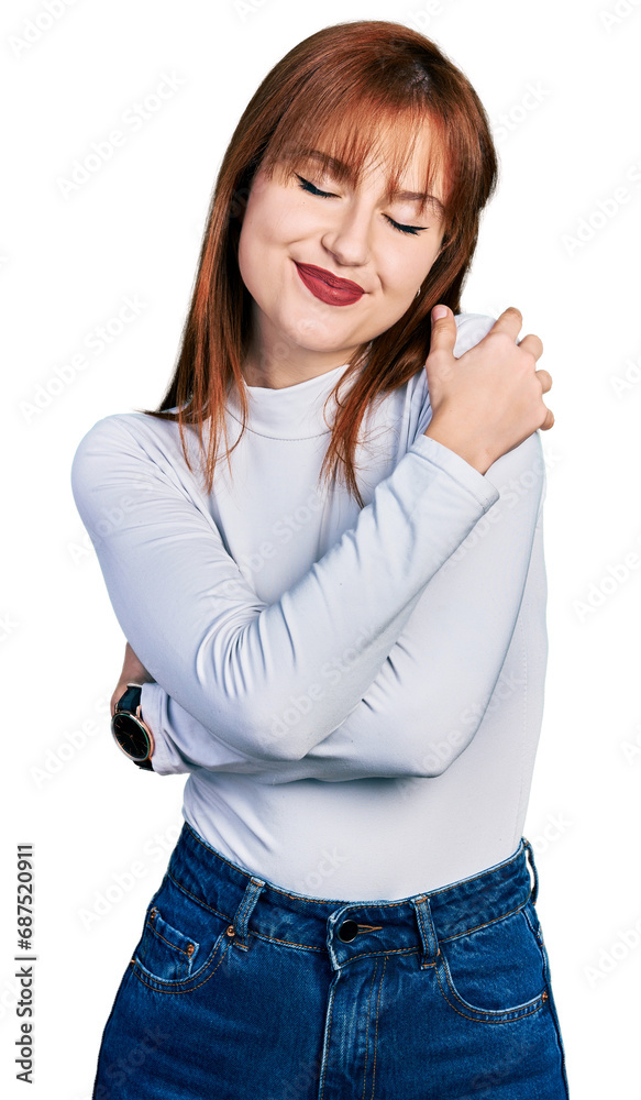 Redhead young woman wearing casual turtleneck sweater hugging oneself happy and positive, smiling confident. self love and self care Redhead young woman wearing casual turtleneck sweater hugging oneself happy and positive, smiling confident. self love and self care
