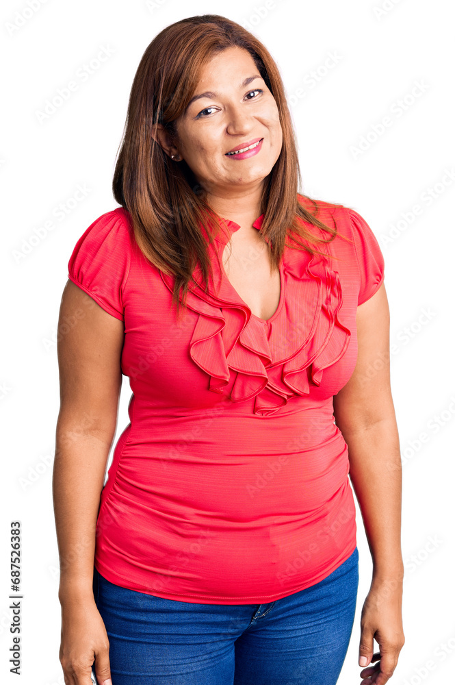 Middle age latin woman wearing casual clothes looking positive and happy standing and smiling with a confident smile showing teeth Middle age latin woman wearing casual clothes looking positive and happy standing and smiling with a confident smile showing teeth