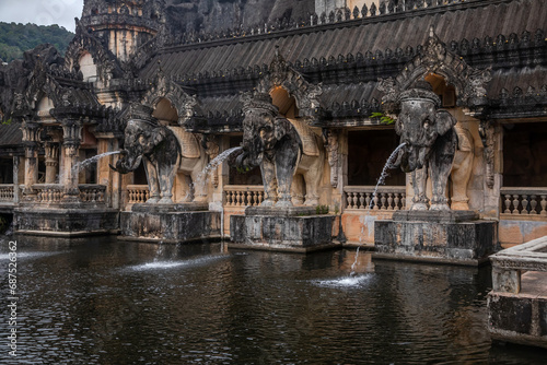 Beautiful ancient Asian architecture. Stone elephants. It's a nasty day.