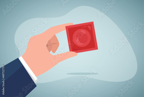 Hand of man holding condom packaging. Gynecologist or pharmacist holding contraceptive flat vector illustration. Medicine, protection, health concept for banner, website design or landing web page