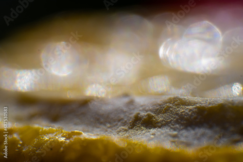 A close-up of a lemon that looks like a hill in the sunshine