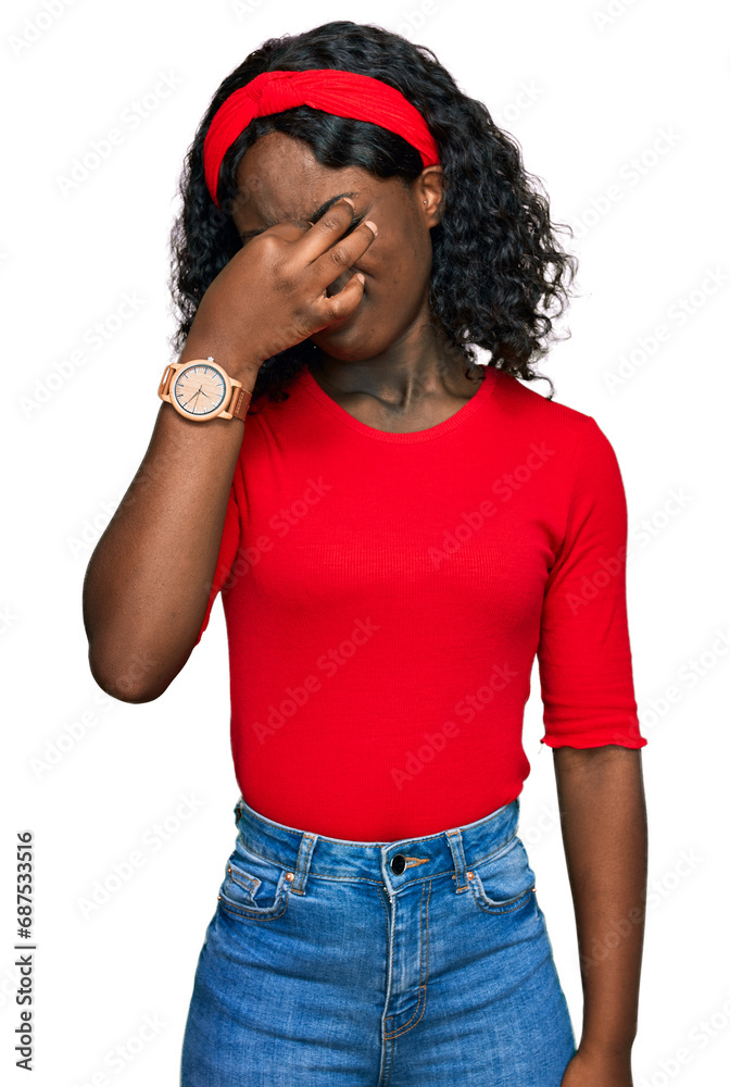 Beautiful african young woman wearing casual clothes tired rubbing nose and eyes feeling fatigue and headache. stress and frustration concept. Beautiful african young woman wearing casual clothes tired rubbing nose and eyes feeling fatigue and headache. stress and frustration concept.