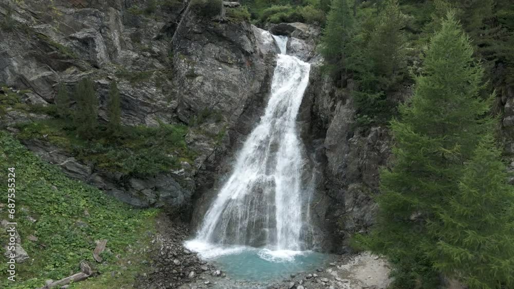 Turning aerial front view of Val Nera waterfall in Livigno Turning aerial front view of Val Nera waterfall in Livigno