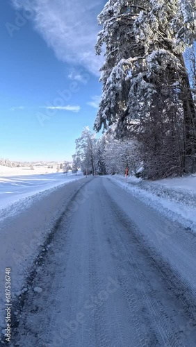 Walking along a snow covered road