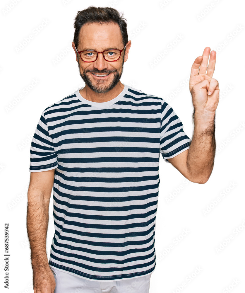 Middle age man wearing casual clothes and glasses showing and pointing up with fingers number three while smiling confident and happy. Middle age man wearing casual clothes and glasses showing and pointing up with fingers number three while smiling confident and happy.