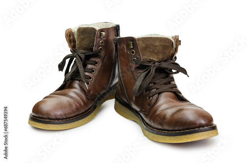 Old stylish men's brown shoes on a white background