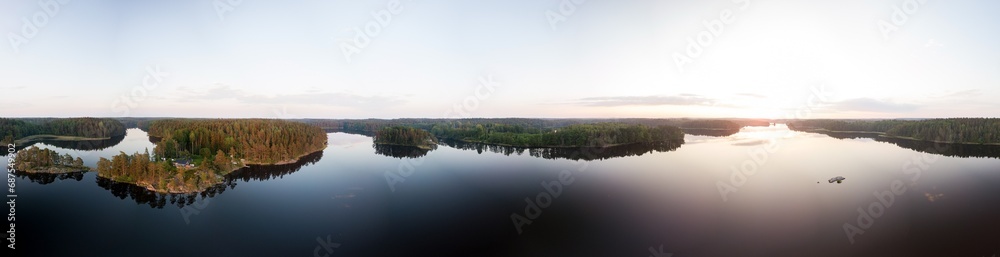 Panoramic summer sunset view of forest lake Panoramic summer sunset view of forest lake