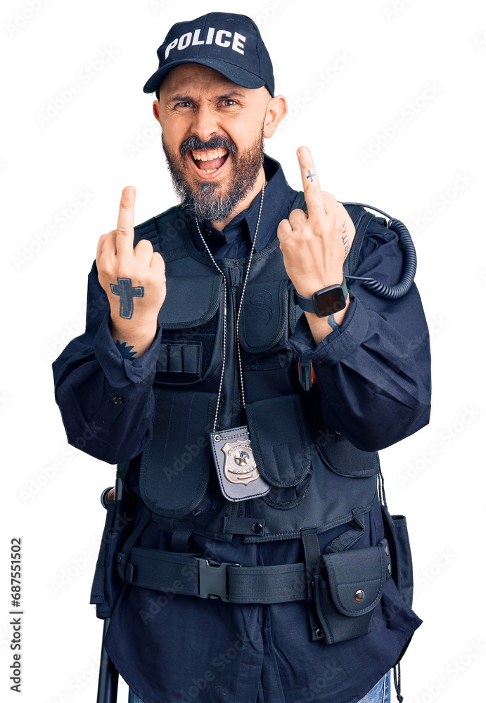 Young handsome man wearing police uniform showing middle finger doing fuck you bad expression, provocation and rude attitude. screaming excited Young handsome man wearing police uniform showing middle finger doing fuck you bad expression, provocation and rude attitude. screaming excited