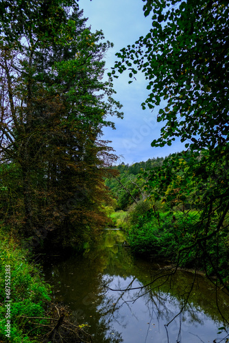 Beautiful landscape in an evening mood by the water in the sunshine.