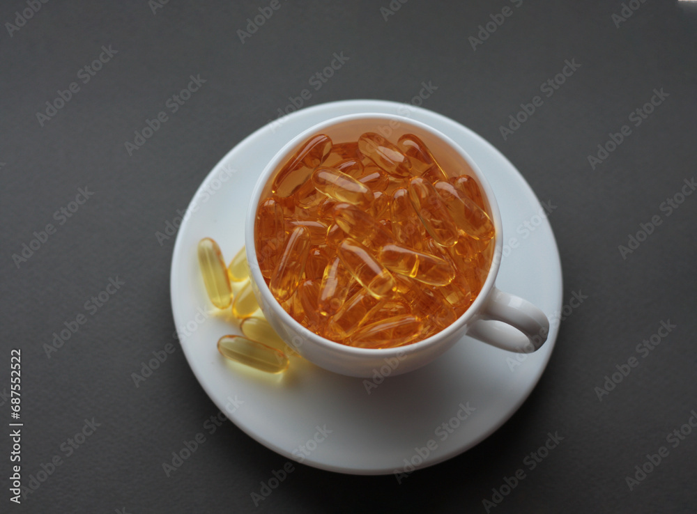 white cup and saucer filled with vitamins white cup and saucer filled with vitamins