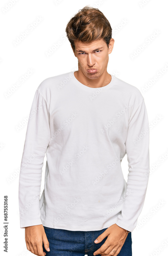 Obraz premium Handsome caucasian man wearing casual white sweater depressed and worry for distress, crying angry and afraid. sad expression.