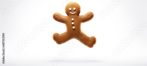 Gingerbread man jumping high on a white blank banner with copy space