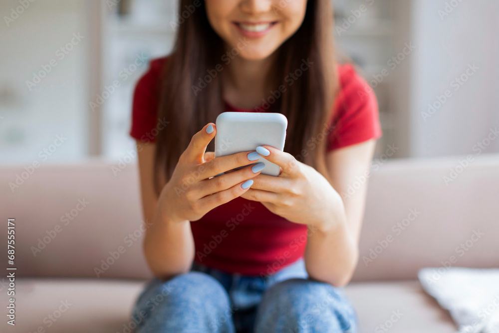 Closeup Shot Of Unrecognizable Female Using Smartphone At Home Closeup Shot Of Unrecognizable Female Using Smartphone At Home