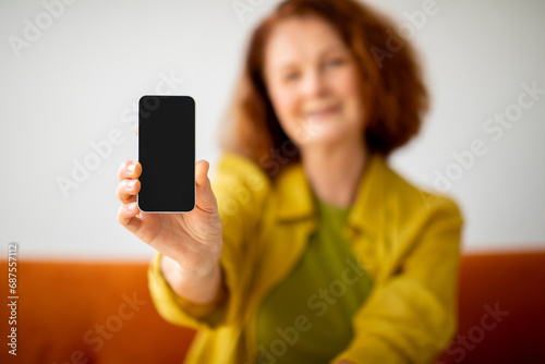 Blank Smartphone With Black Screen In Hand Of Senior Woman
