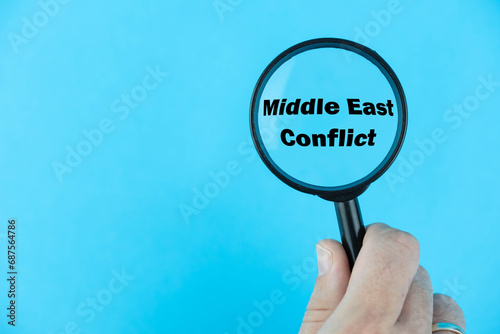 Middle East Conflict, under magnifying glass focused on the term. A visual exploration of the multifaceted dynamics, geopolitical intricacies, and persistent challenges in the region. photo