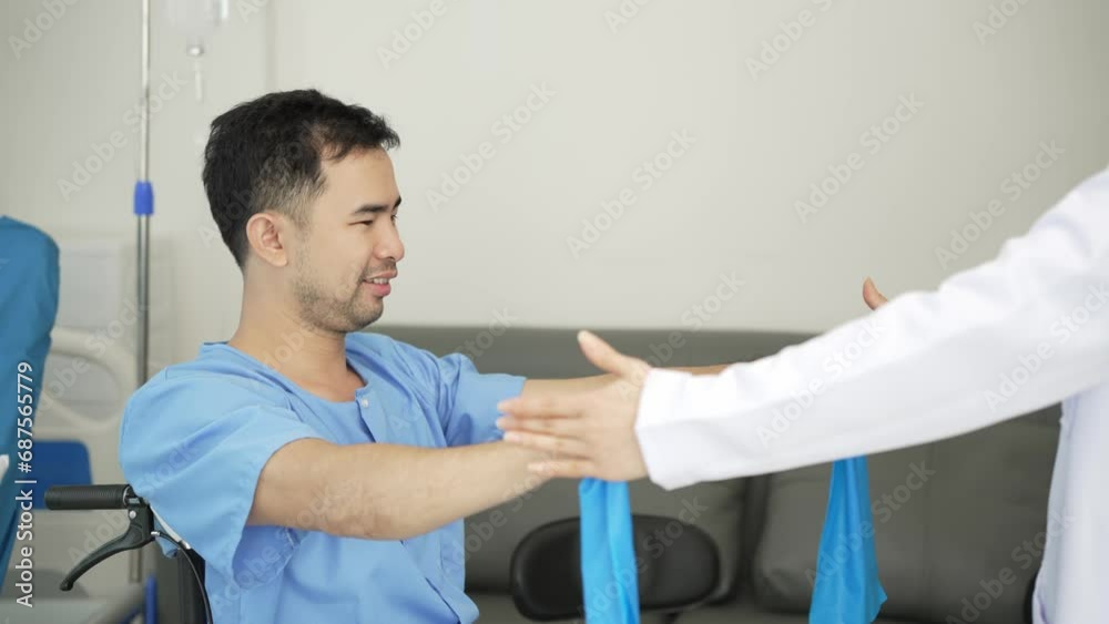 Nurse helping physical therapy of male patient at hospital, Asian female physical therapist working and helping protect patient's hands. Patient stretches muscles in clinic 4k Nurse helping physical therapy of male patient at hospital, Asian female physical therapist working and helping protect patient's hands. Patient stretches muscles in clinic 4k