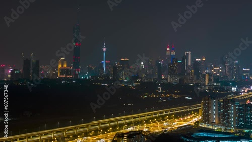 Wallpaper Mural Cinematic aerial drone night scene hyperlapse of Kuala Lumpur city skyline with elevated highway, residential and city skyline.  Torontodigital.ca
