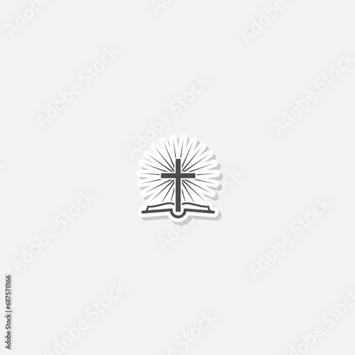 Christian cross and book logo sticker isolated on gray background © sljubisa