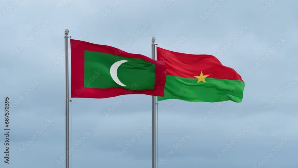 Burkina Faso flag and Maldives flag waving together on cloudy sky, endless seamless loop, two country relations concept Burkina Faso flag and Maldives flag waving together on cloudy sky, endless seamless loop, two country relations concept