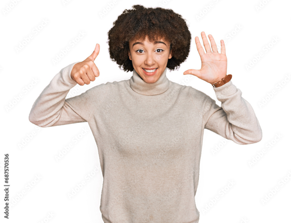 Young hispanic girl wearing wool winter sweater showing and pointing up with fingers number six while smiling confident and happy. Young hispanic girl wearing wool winter sweater showing and pointing up with fingers number six while smiling confident and happy.