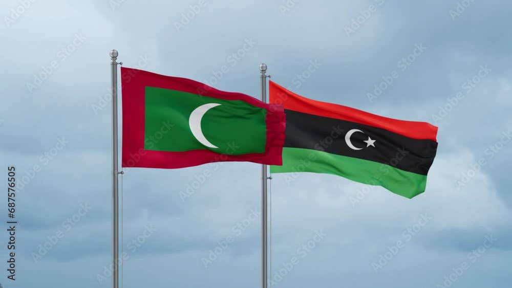 Libya and Maldives flag waving together on cloudy sky, endless seamless loop, two country cooperation concept Libya and Maldives flag waving together on cloudy sky, endless seamless loop, two country cooperation concept