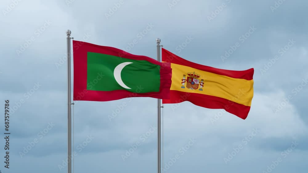 Spain and Maldives flag waving together on cloudy sky, endless seamless loop, two country cooperation concept