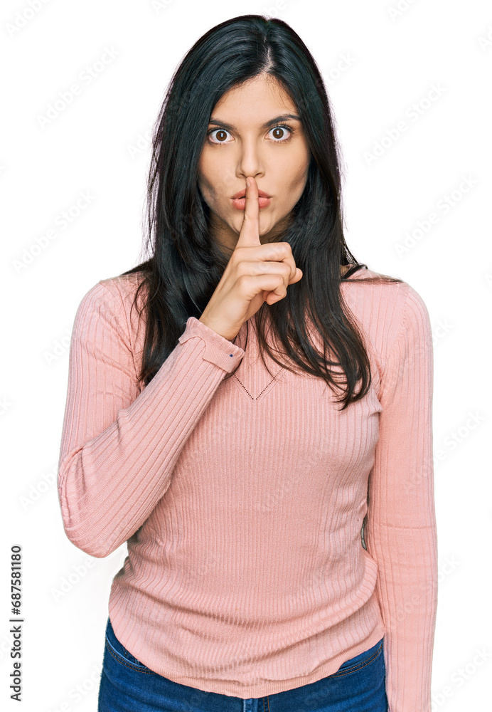 Young hispanic woman wearing casual clothes asking to be quiet with finger on lips. silence and secret concept. Young hispanic woman wearing casual clothes asking to be quiet with finger on lips. silence and secret concept.