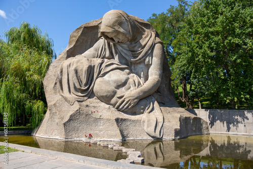 Close-up view Mourning mother sculpture in Mamayev Hill War Memorial in a sunny summer day. Russian culture and soviet architecture theme.