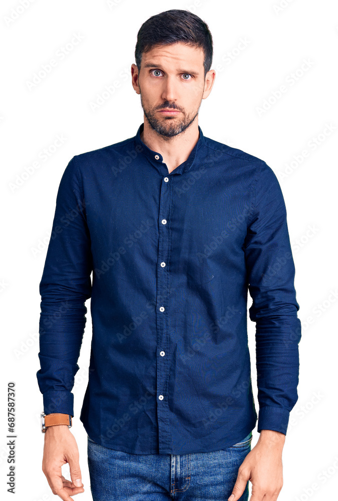 Young handsome man wearing casual shirt skeptic and nervous, frowning upset because of problem. negative person. Young handsome man wearing casual shirt skeptic and nervous, frowning upset because of problem. negative person.